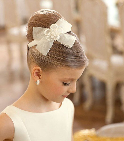 flower girl updo hairstyle with bow