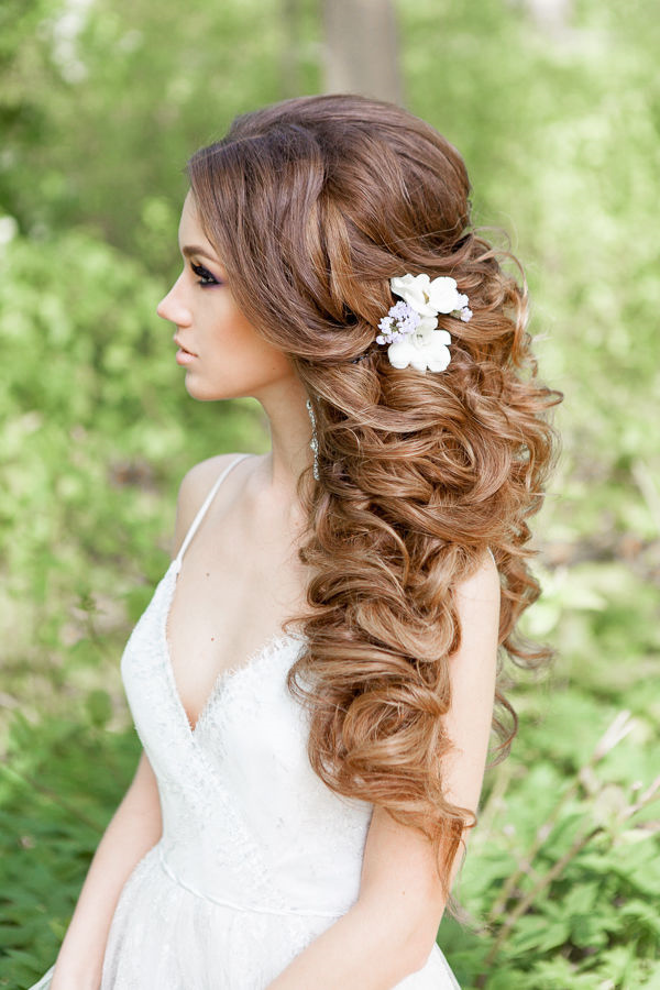 half up half down curly hairstyle with flowers picture