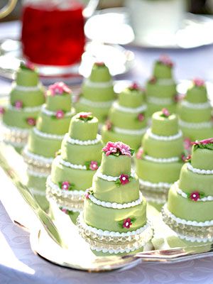 lime green mini wedding cakes with purple flowers