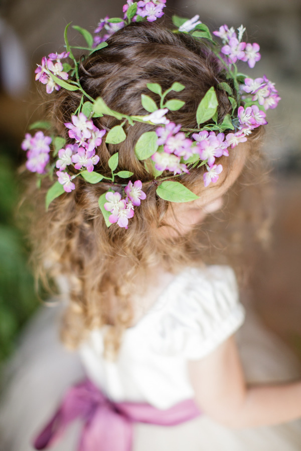 little girls hairstyle with purple flowers