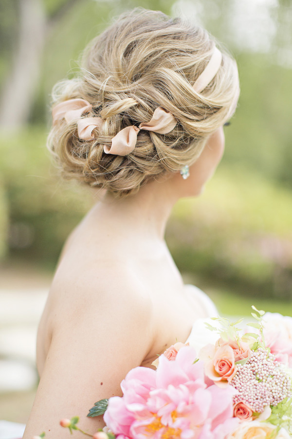 messy loose curls wedding updo with blush ribbon