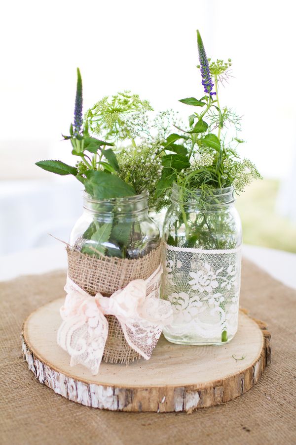 nohemian rustic wilflowers tree stump wedding centerpiece