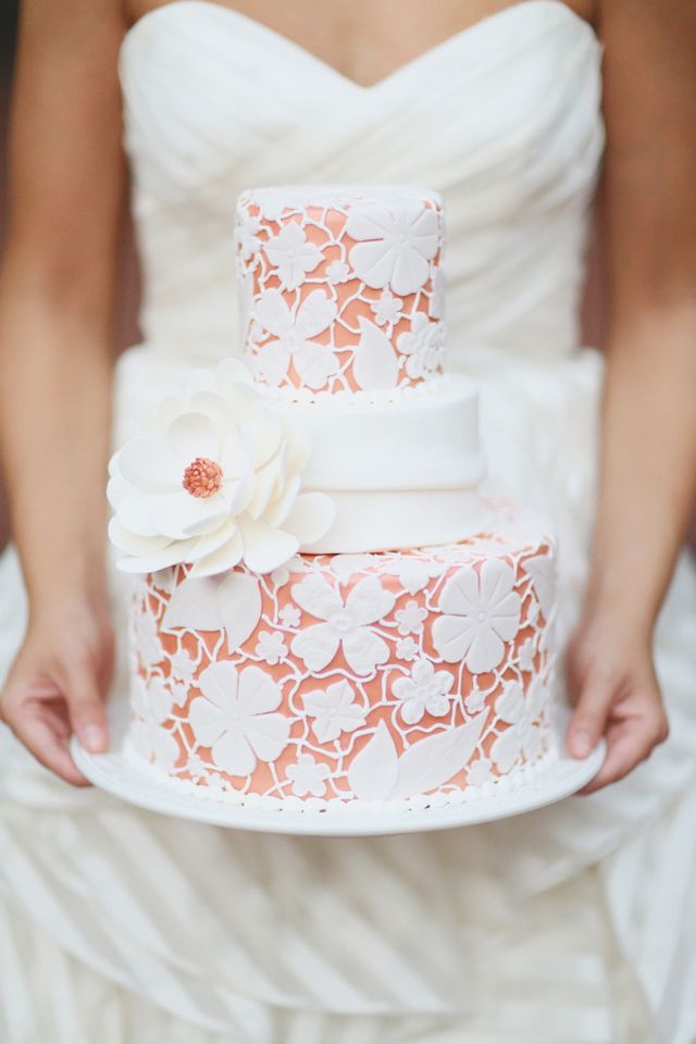 peach orange wedding cake with lace and sugar flower detailing