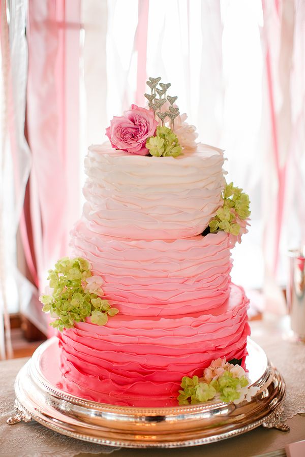 pink ombre ruffles wedding cake with green hydrangea
