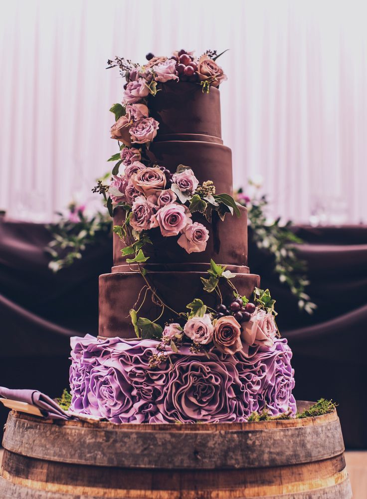 plum purple ruffles wedding cake with roses