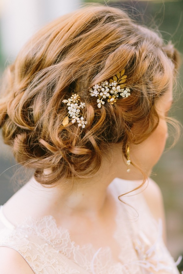 romantic messy loose curls wedding updo with pearl pin