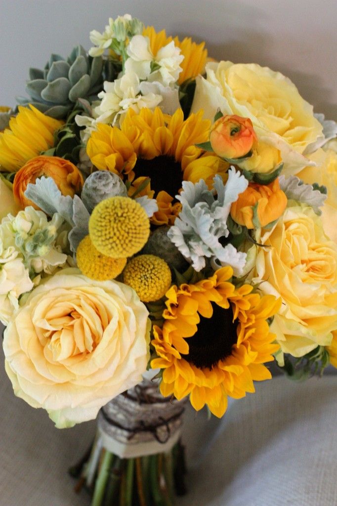 rustic yellow bridal bouquet with yellow billy balls sunflowers succlents