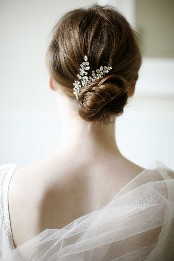 simple low wedding hairstyle updo with hair comb