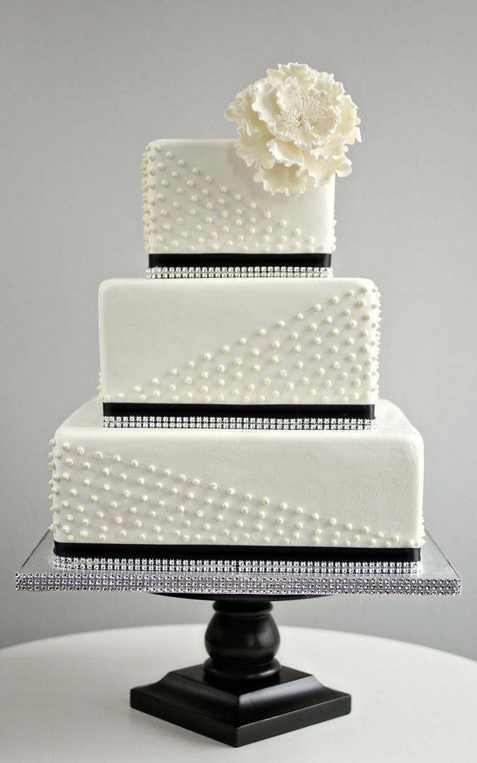 simple square black and white wedding cake with pearl detail