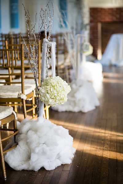 snow along the aisle for a winter wedding ceremony
