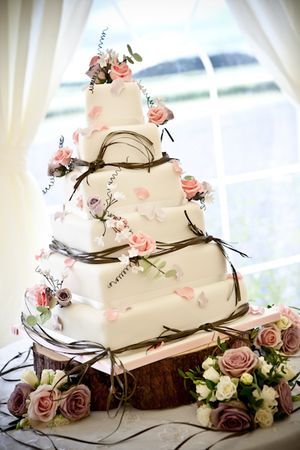 square cake with flowers and ribbon