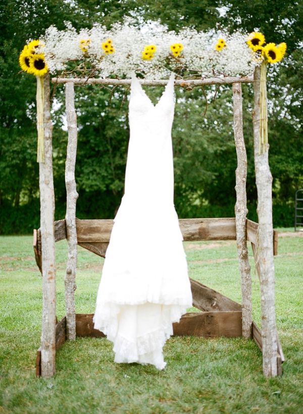 super cute wedding alter decorated with sunflower and baby's breath