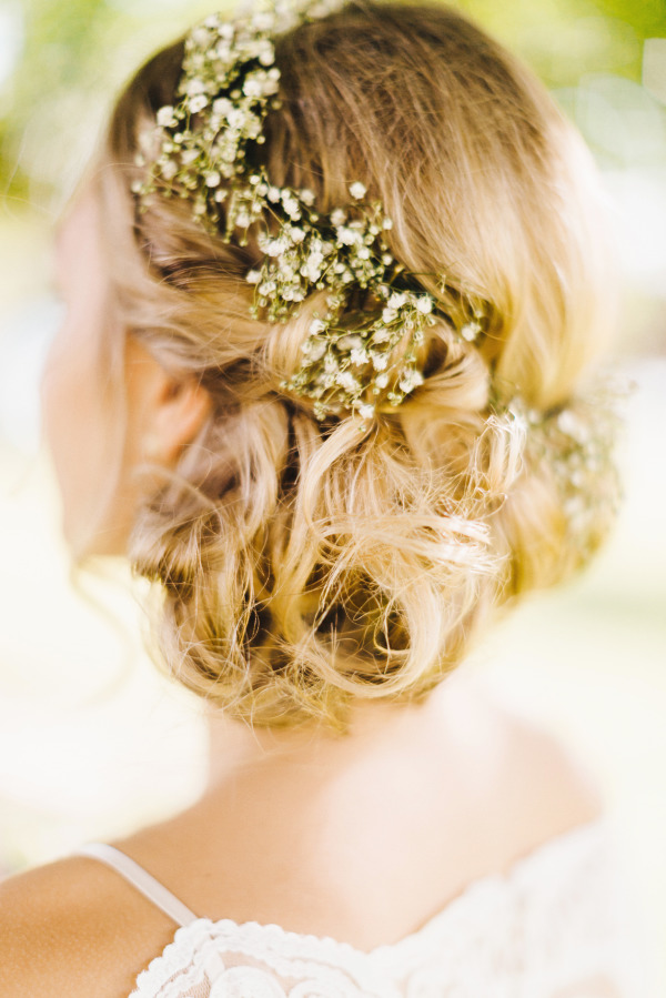 vinatge rustic wedding hairstyle-low bun updo with baby's breath