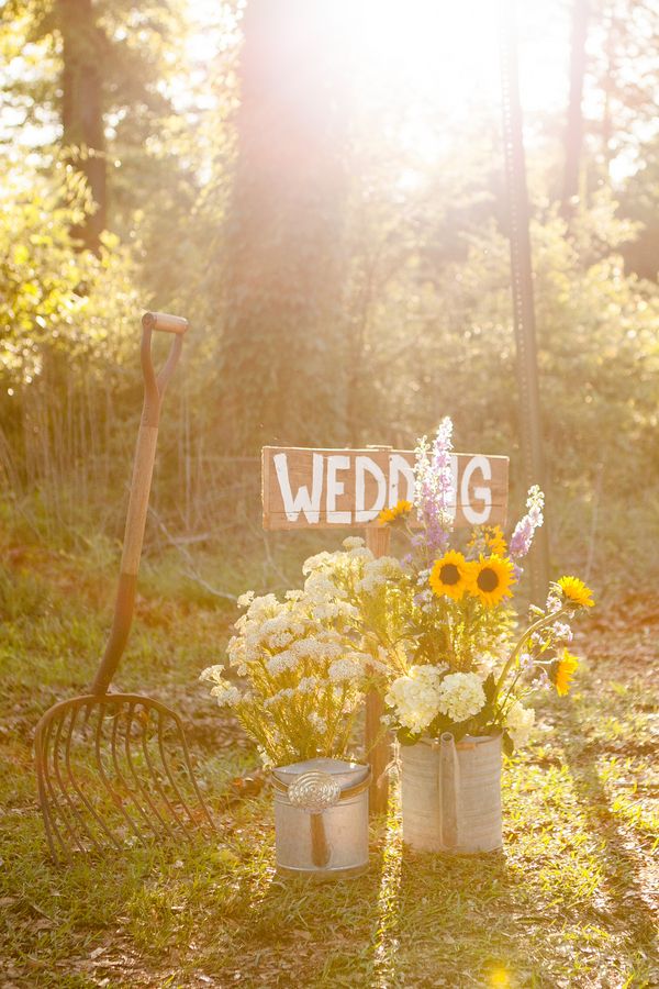 watering cans and sunflowersfor a farm or barn wedding