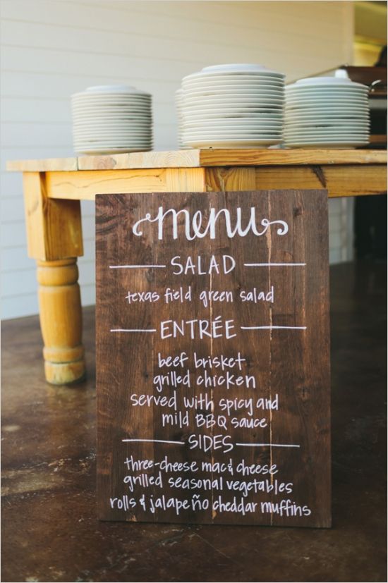 wedding menu on wooden sign