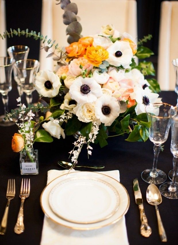 white anemones with orange ranunculus wedding centerpiece