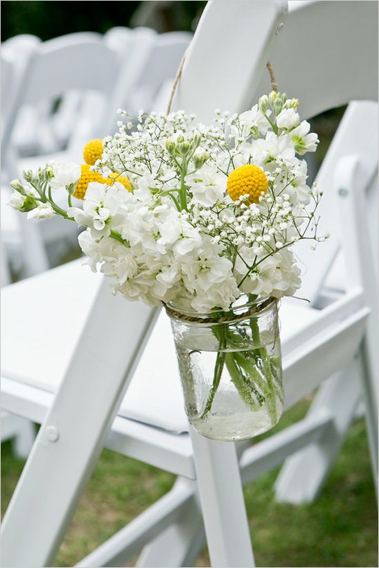 white ceremony floral with yellow billy balls wedding aisle