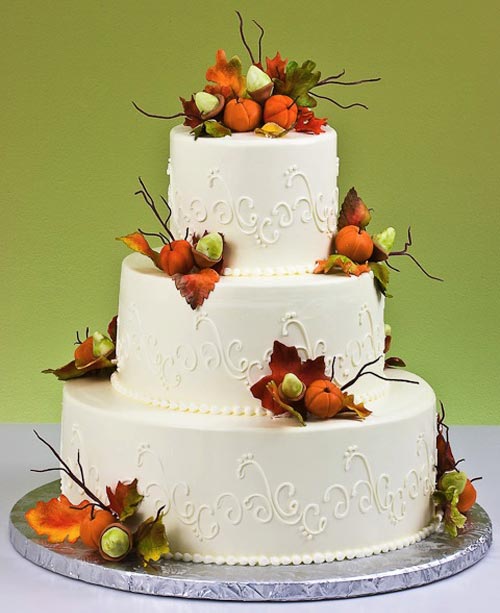 white fall autumn wedding cake with sugar pumpkin decors