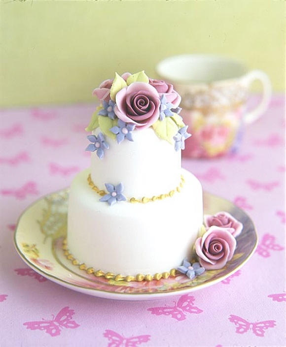 white mini wedding cake with pastel sugar flowers