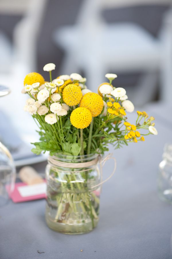 wine bottle and mason jar wildflower billy balls centerpieces