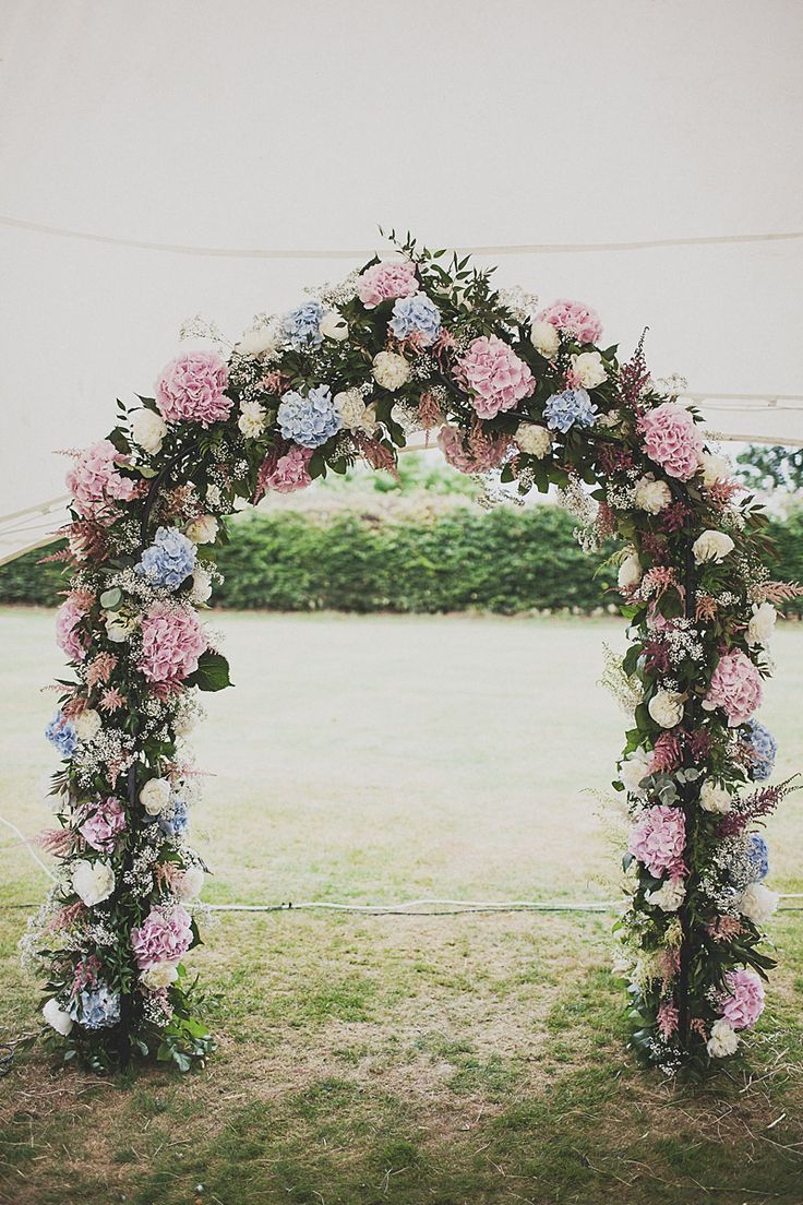 25+ Stuning Wedding Arches with Lots of Flowers 13 Bohemian Wedding Arch Alter With Wildflowers