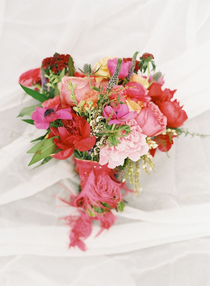 Colorful mixed rose and peony red wedding bouquet