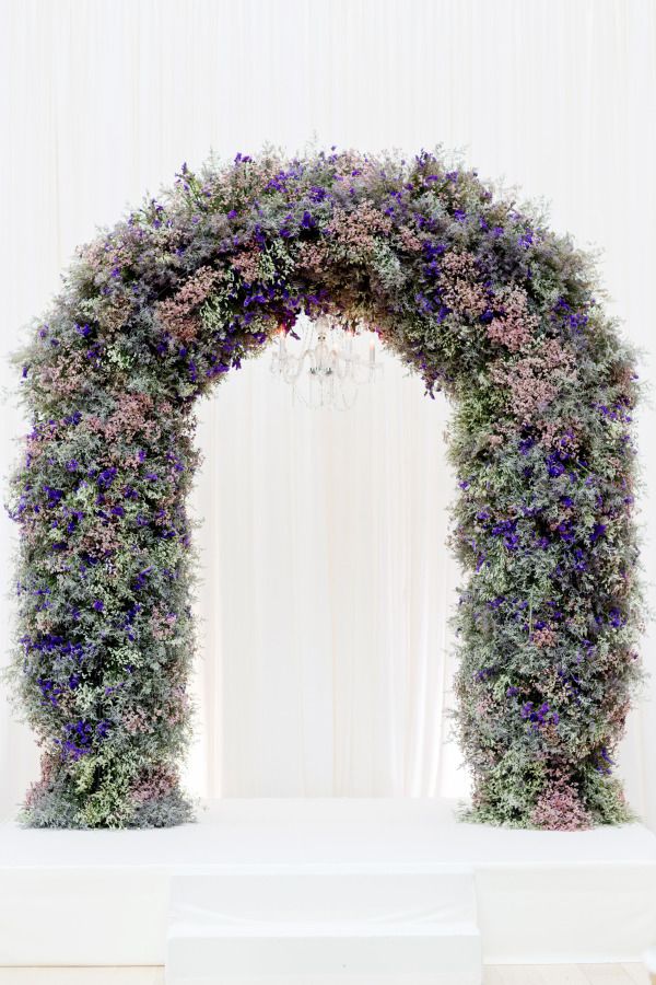 25+ Stuning Wedding Arches with Lots of Flowers 19 Dreamy pink and purple flower wedding arch