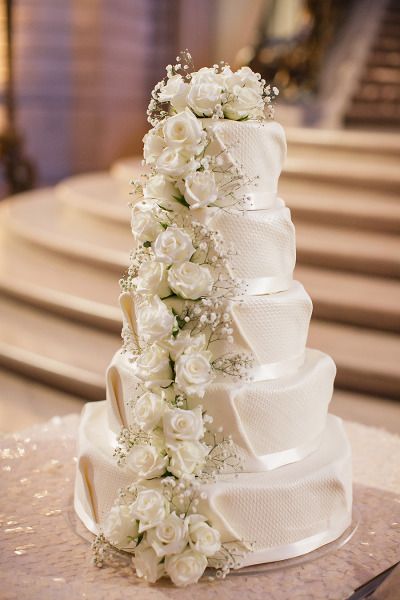 Elegant ballroom white cake with white roses