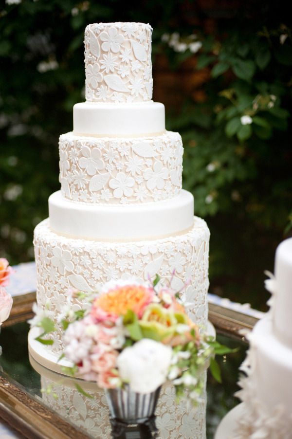 Floral laser cut white wedding cake