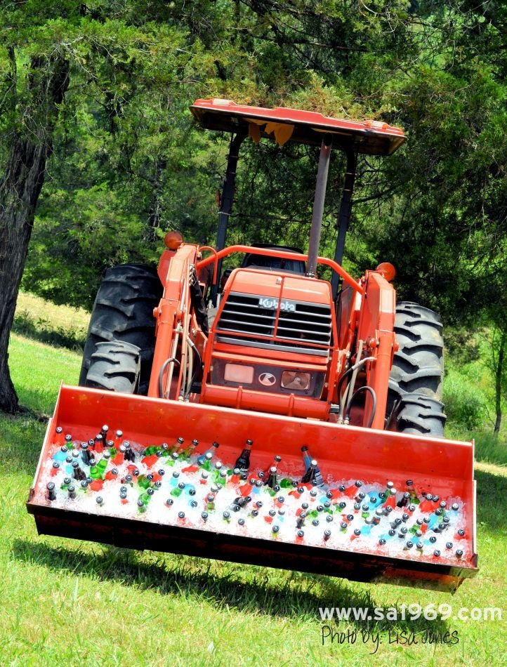 Front loader used to ice down drinks for wedding guests