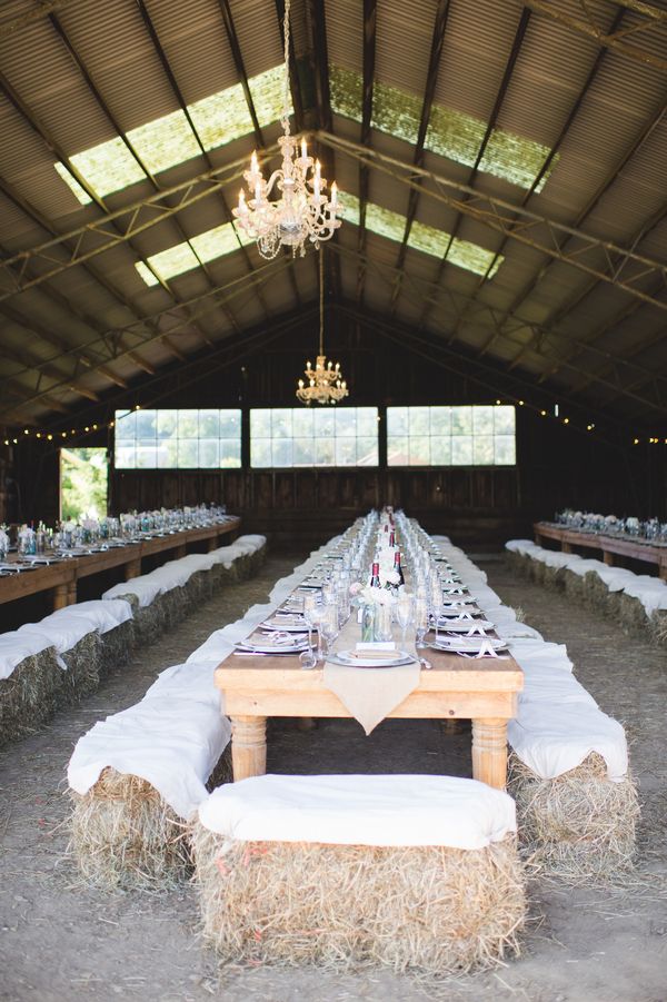 Fun barn wedding with haybale seating
