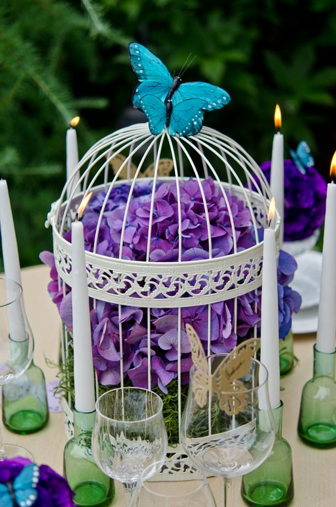 Hydrangea, cage, and butterfly centerpiece