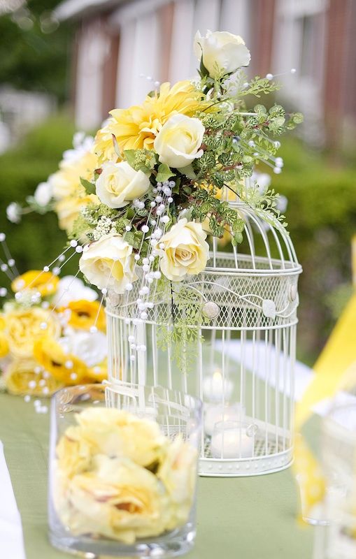 25 Amazing Birdcage Wedding Centerpieces (with Tutrial) 8 Large Birdcage and Yellow Flower Centerpiece Idea