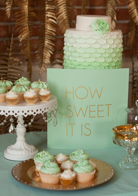 Mint and gold dessert display with gold spray painted hanging fern fronds