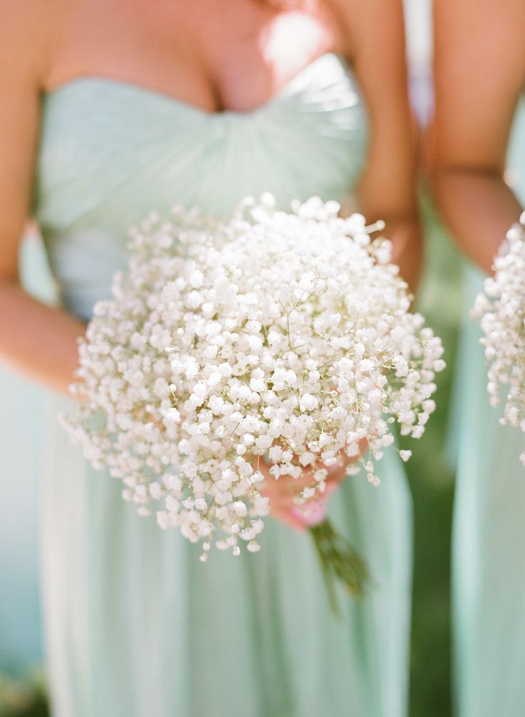 Mint bridesmaid dresses and baby's breath bouquets