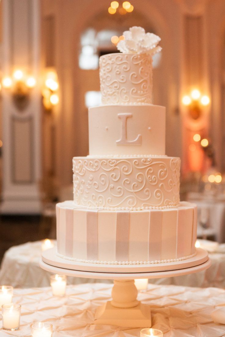 Patterned ivory wedding cake with monogram - layered tiered wedding cakes