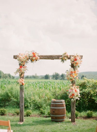 Rustic ceremony arch ideas with wine barrel