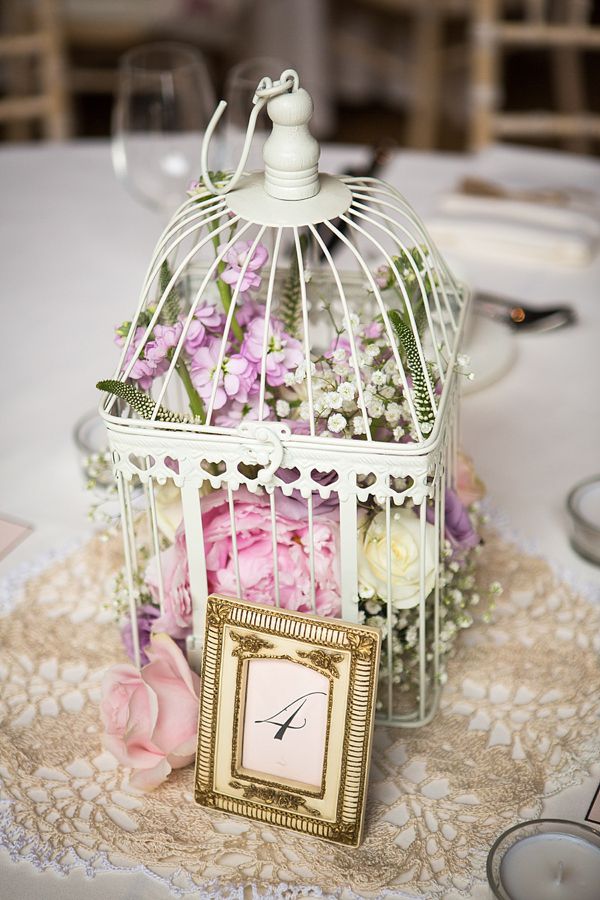 Vintage wedding centerpiece ideas-pastel flowers in birdcage