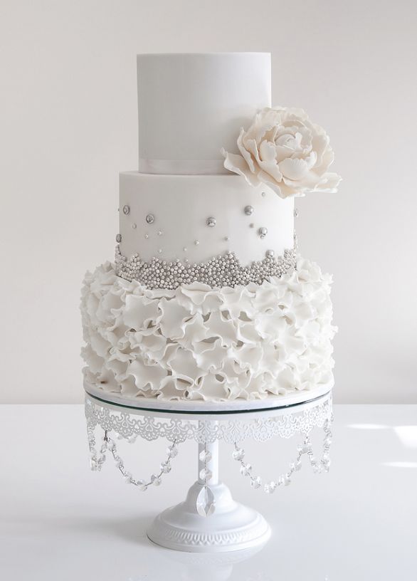 All White Ruffles Wedding Cake With Silver Sugar Pearls Deer