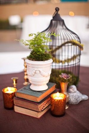 25 Amazing Birdcage Wedding Centerpieces (with Tutrial) 21 black birdcage and books wedding centerpiece