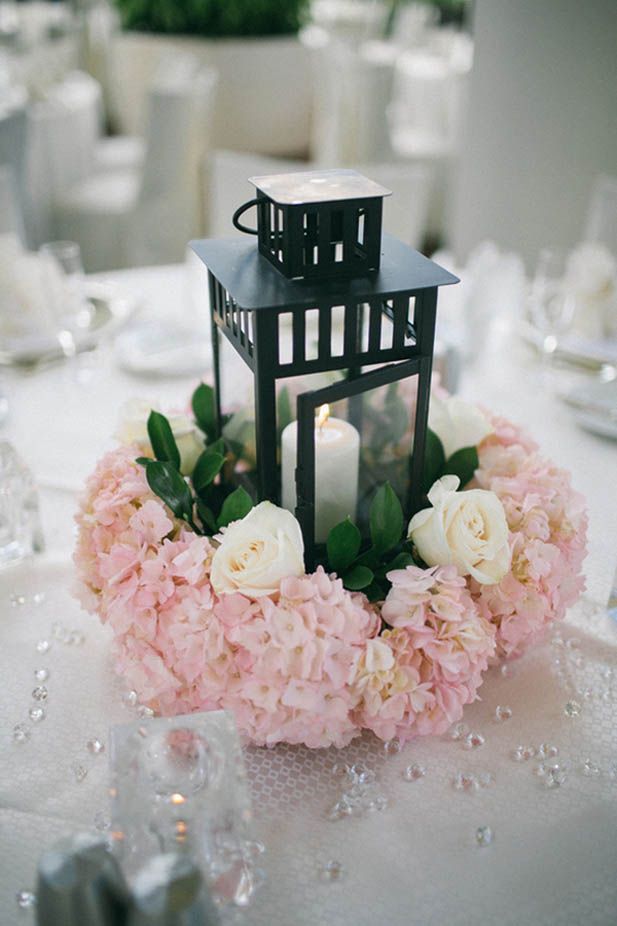 black lantern and pink flowers wedding centerpieces