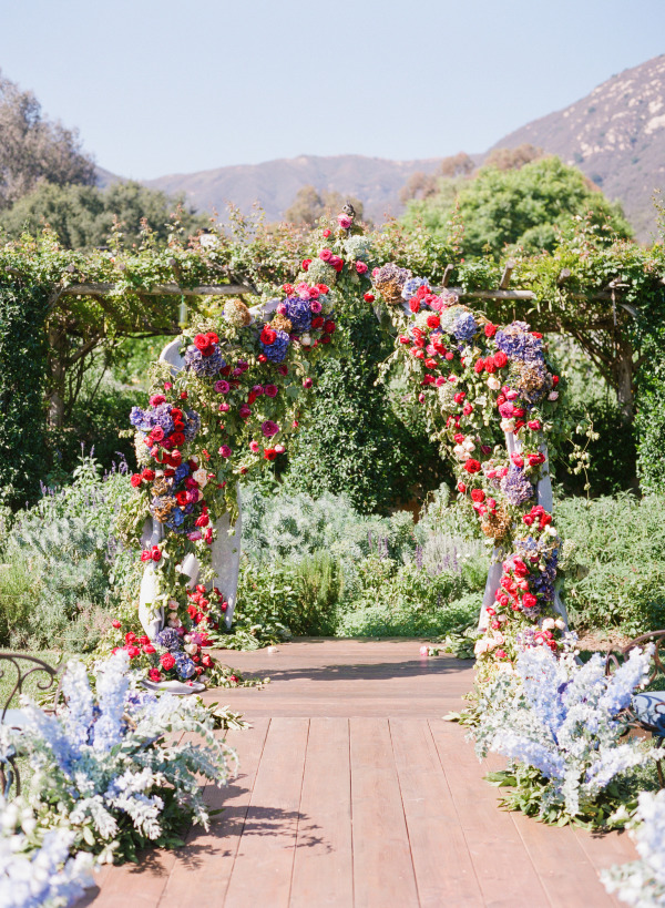 boho pink purple and red flowers wedding arch alter