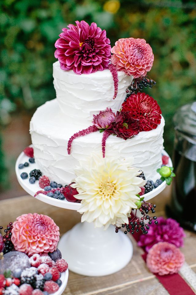 buttercream wedding cake with burgundy dahlias
