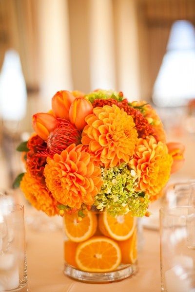 fall orange dahlia wedding centerpiece with orange zinnias