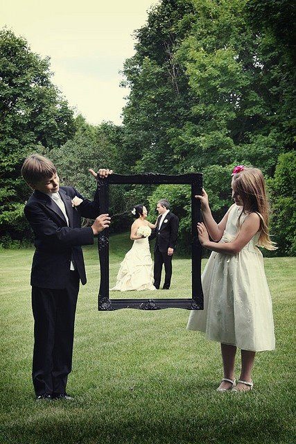 flower girl and ring bearer capture the bride & groom