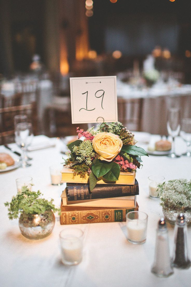 flowers and book wedding table number centerpiece ideas