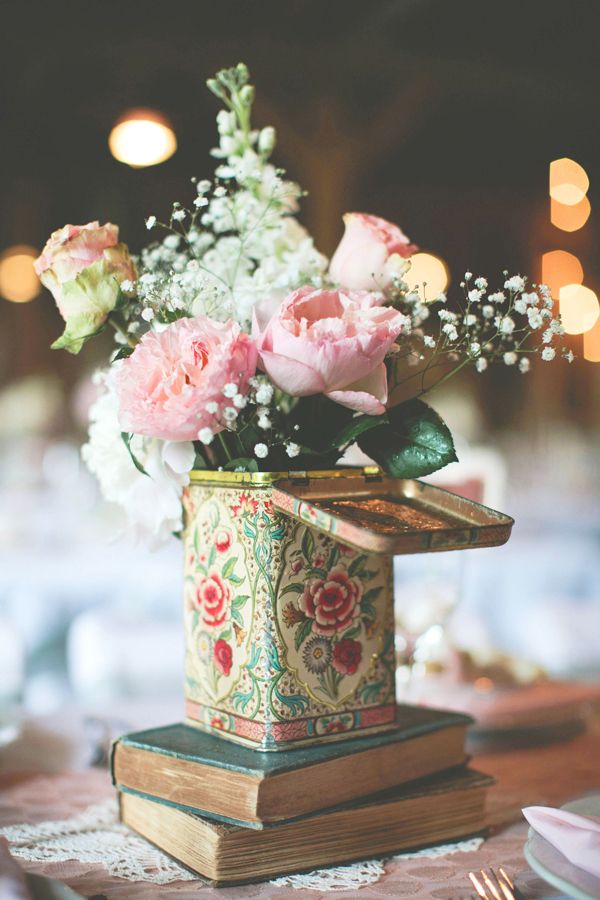 flowers in vintage tin and book wedding centerpiece ideas