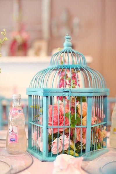 25 Amazing Birdcage Wedding Centerpieces (with Tutrial) 22 flowers of fairy lights in a lovely blue bird cage wedding centerpiece