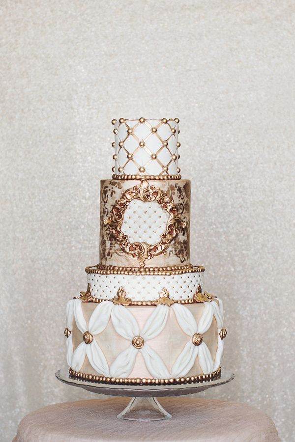 gold and white ornate wedding cake