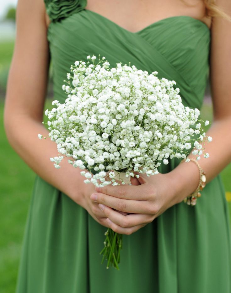 green bridesmaid dress and white bouquet